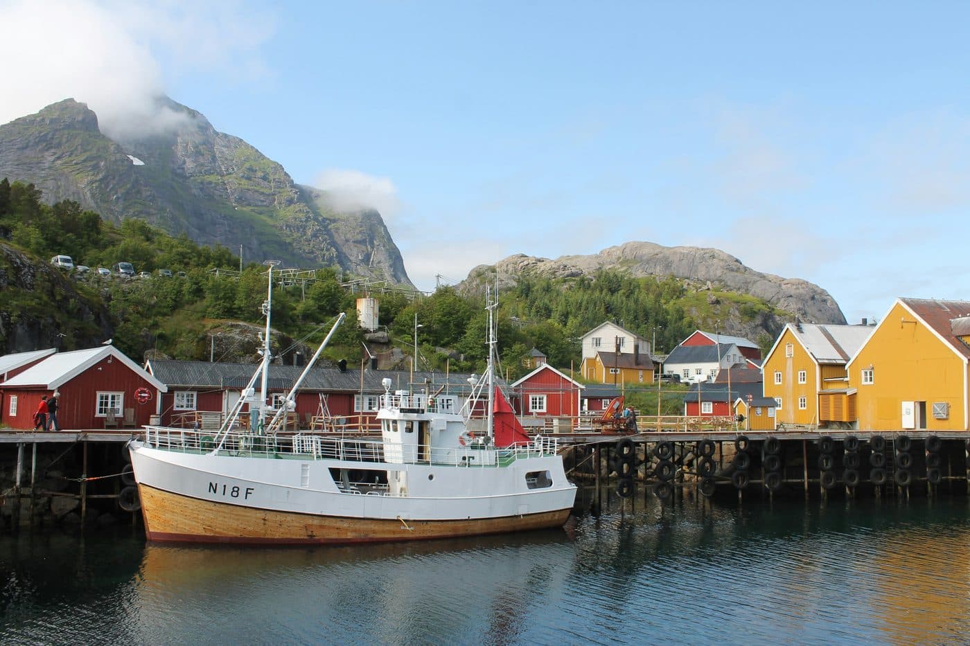 Traditional red rorbuer cabins on the water in Lofoten, Arctic Norway